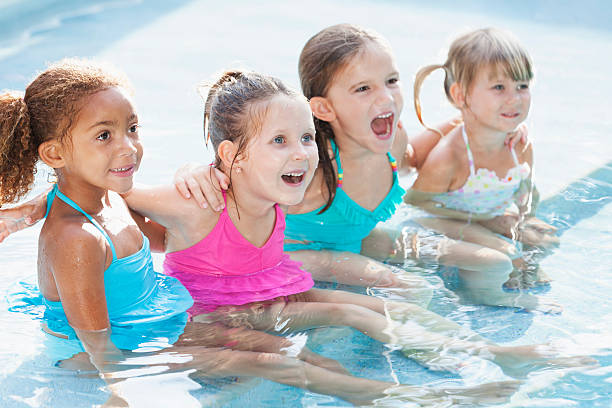 istock Little girls in swimming pool 483371717