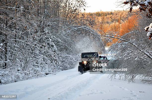 One Jeep Tows Out Another Stuck In Snow Stock Photo - Download Image Now - 4x4, Dragging, Horizontal