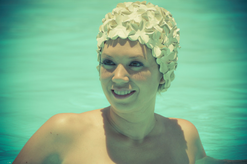 Model in white floral bathing cap