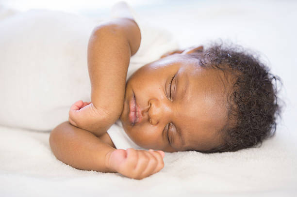 istock Mother cuddling with her baby 483375586