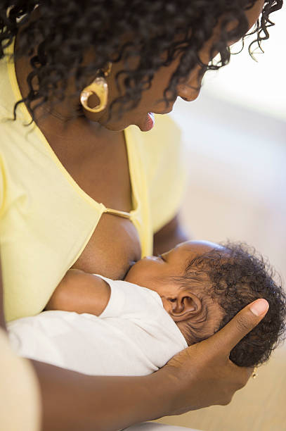 istock Mother cuddling with her baby 483375596