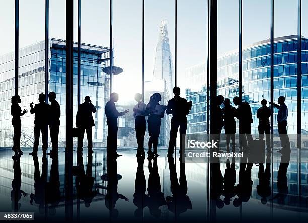 Silhouettes Of World Business People Having A Group Discussion Stock Photo - Download Image Now