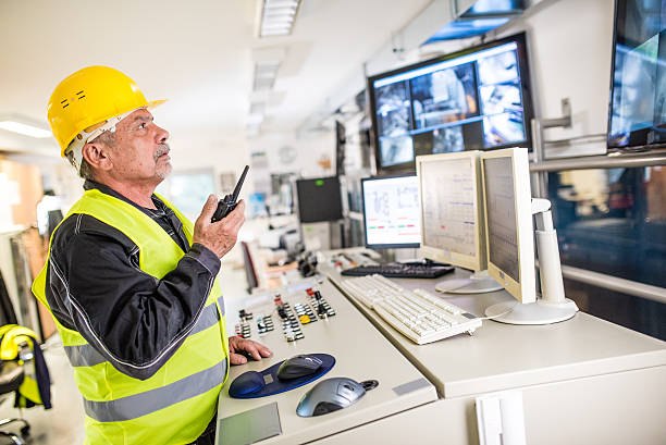 istock Man operating walkie-talkie at recycling plant 483380966