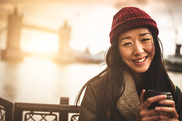 istock chinese tourist smiling in London 483390293