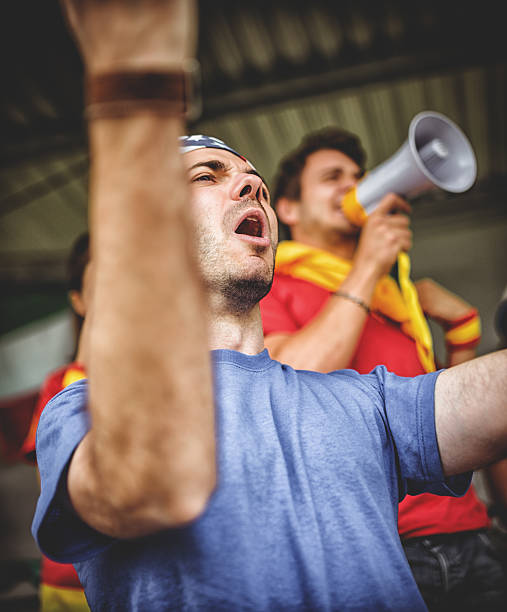 istock Spanish and american supporter at the stadium 483390825