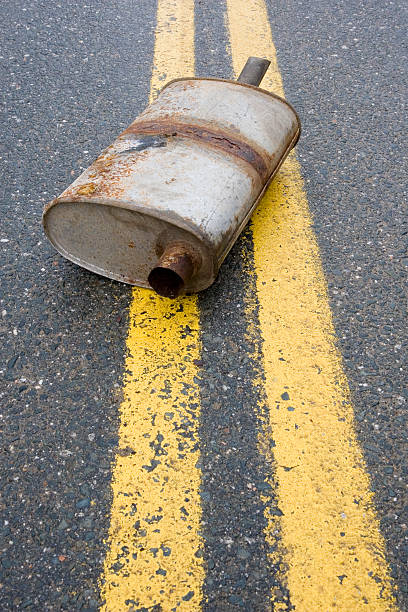istock Old muffler in the road 483390929