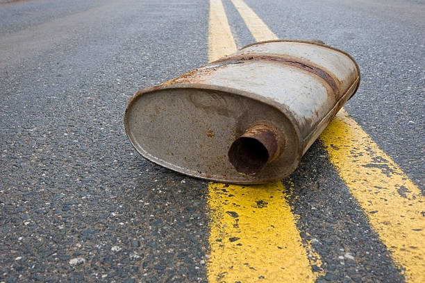 istock Old muffler in the road 483391319