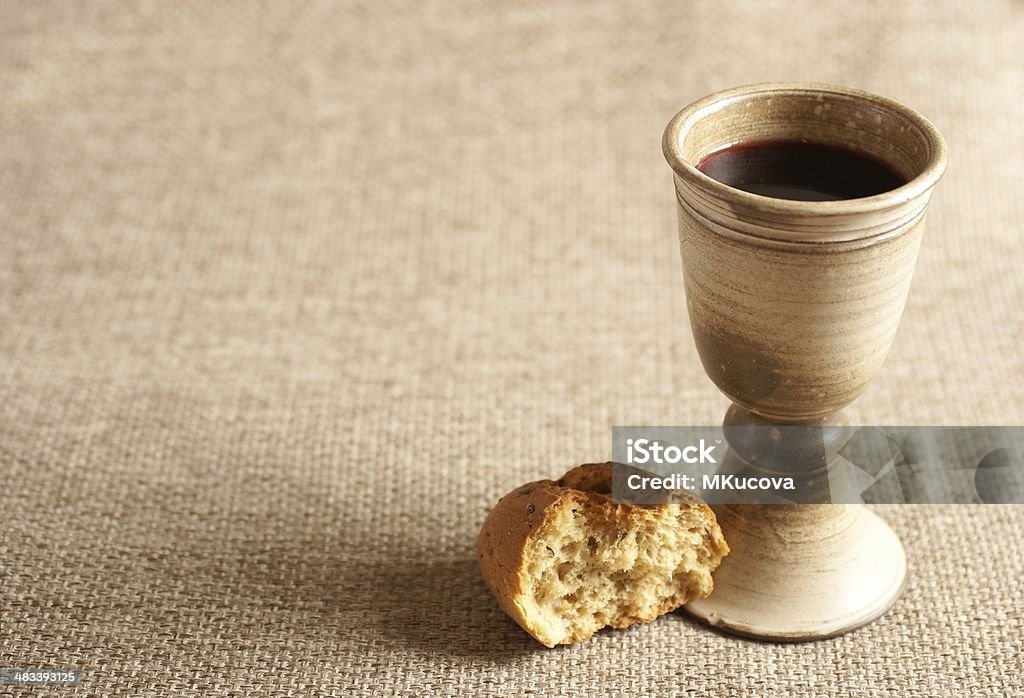 Bread and wine Chalice with wine and bread. Background with copy space. Communion Stock Photo