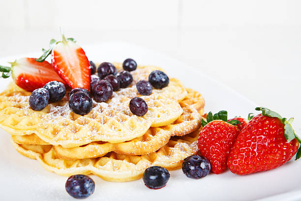 istock Crisp golden fresh baked waffle topped with pomegranate 483394473