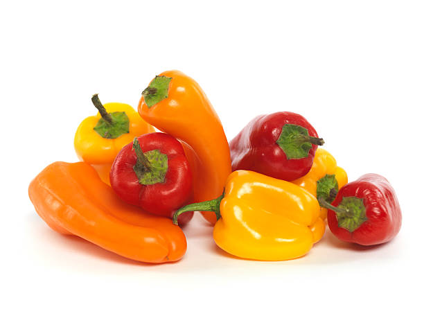 Small Sweet Peppers Small colorful sweet peppers isolated on white background bell pepper stock pictures, royalty-free photos & images