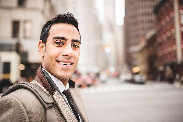 istock Businessman smiling while he's crossing the street 483395127