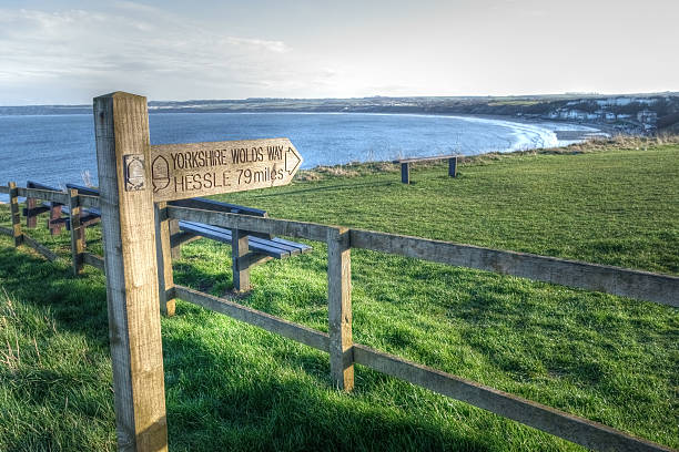 Start of the Yorkshire Wolds Way One of the starting points of the Yorkshire Wolds Way National Trail at Filey, North Yorkshire. The other starting (or finishing) point is at Hessle, 79 miles away. yorkshire wolds way stock pictures, royalty-free photos & images
