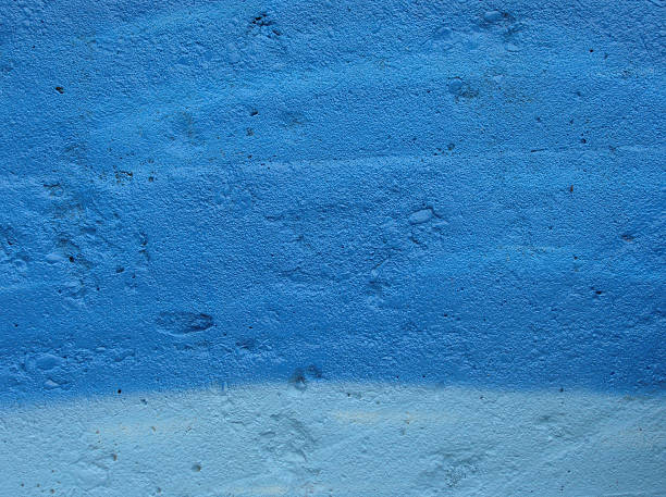 istock concrete wall spray painted in 2 types of blue 483395861