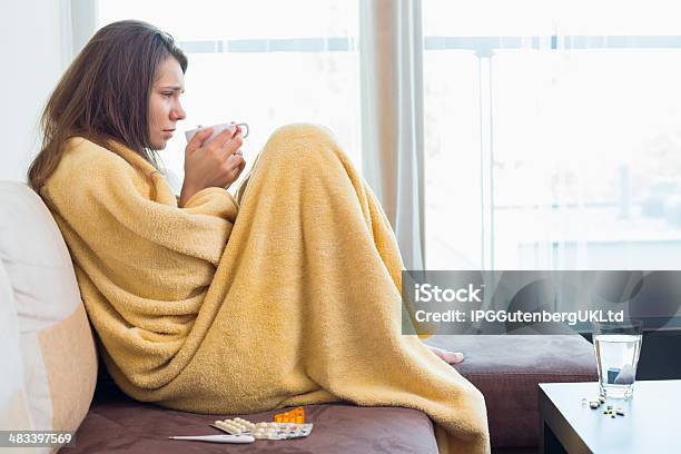 Side View Of Sick Woman Having Coffee Stock Photo - Download Image Now - 20-24 Years, 20-29 Years, Adult