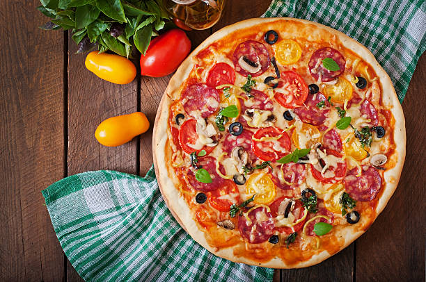 istock Pizza with salami, tomato, cheese and olives 483402556