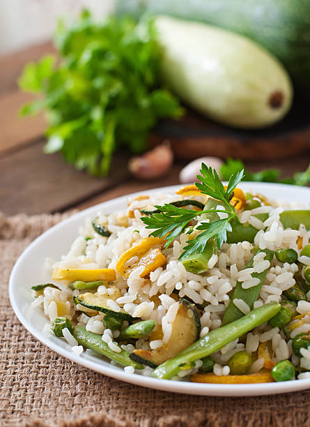 istock Risotto with asparagus beans, zucchini and green peas 483402658