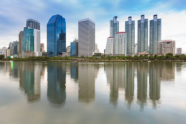 istock Beautiful water reflection of city office building 483405182