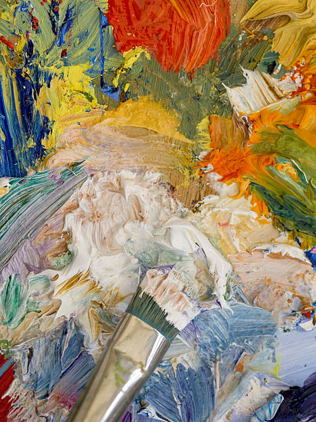 Artists oil paints and paint brush vibrant multi-coloured close-up Art oil paints and paint brushes vibrant multi-coloured close-up oil paint palette stock pictures, royalty-free photos & images