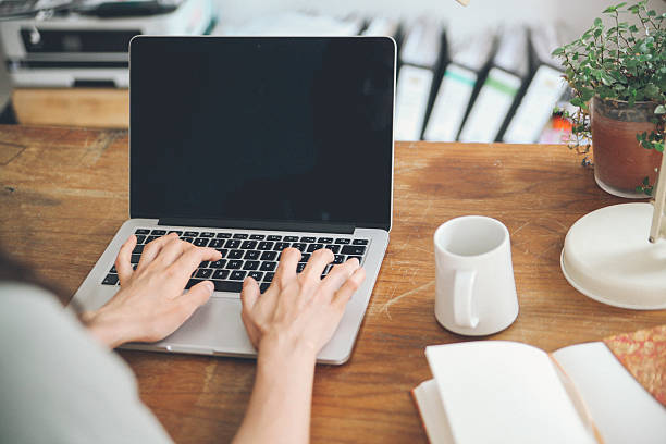 istock Female novelist writing on the laptop 483406488