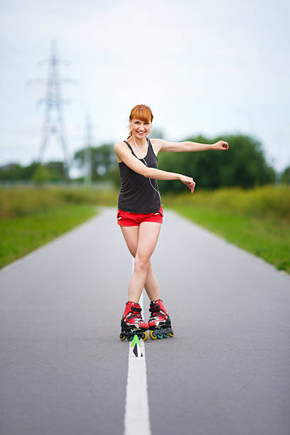 istock Attractive young girl on roller skates 483406930