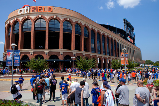 Queens, New York, USA  - July 11, 2015: Met fans in line to head in to Citi Field also known as Mets Baseball Stadium in  Flushing Meadows–Corona Park in Queens (New York City). This stadium Replaced Shea Stadium in  2009 and is the home baseball park of Major League Baseball's New York Mets. 