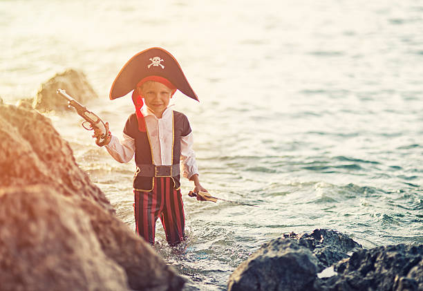 istock Little pirate captain in water 483410096