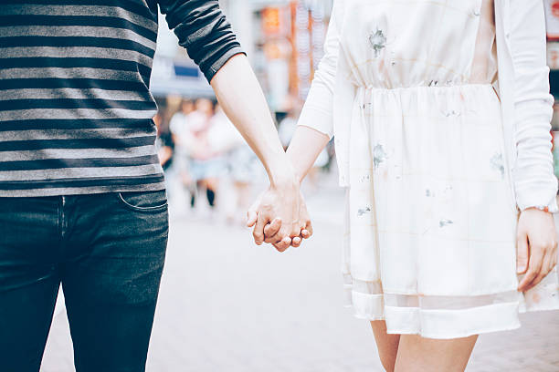 istock Young couple against cityscape background 483410458