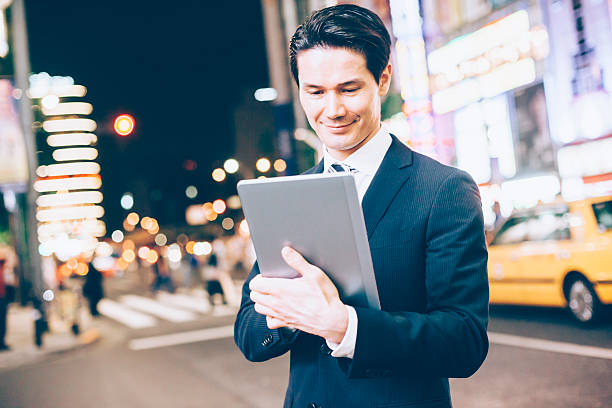 istock Asian businessman answering mobile phone 483410468