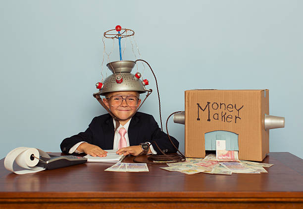 istock Young Boy Makes Money with Idea Helmet 483411936