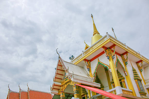 istock White temple and top gold pagoda on sky background 483413060