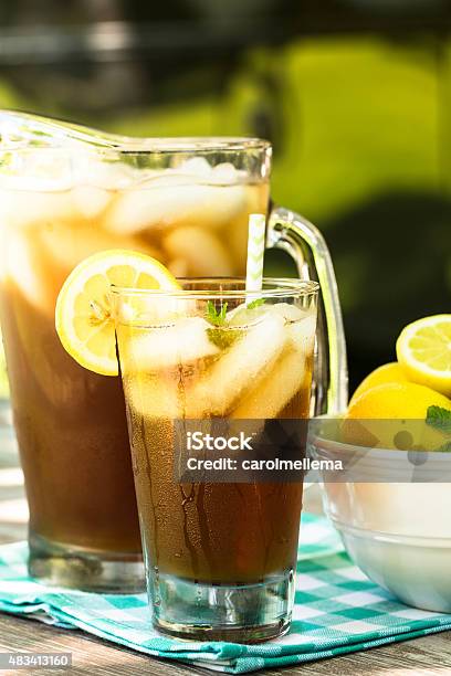 Glass Of Iced Tea With Lemons And Mint In Summer Stock Photo - Download Image Now - 2015, Cold Drink, Drink