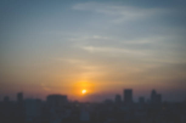 istock Blurred silhouette of buildings against sunset 483416856