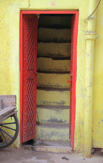 red door and yellow wall, Delhi, India