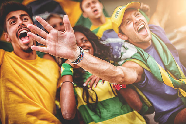 istock Group of brazilian supporters at stadium 483420051