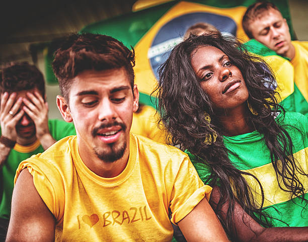 istock sad brazilian supporters at stadium 483420297