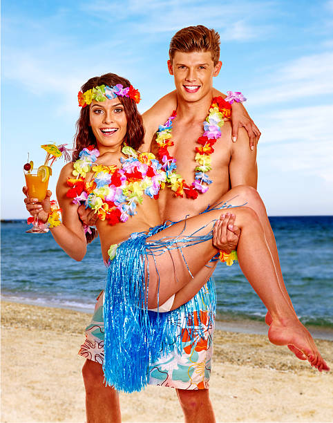 istock Couple with cocktail at Hawaii wreath beach 483420300