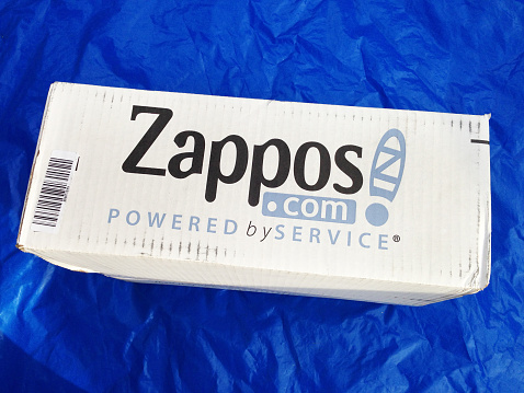 West Palm Beach, USA - January 3, 2014: Zappos.com merchandise delivery package. Zappos.com is an on line shoe and clothing retail store. It was acquired by Amazon.com in 2009. 
