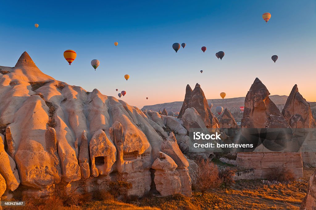 Cappadocia, Turkey Hot Air Balloons rise up over the Goreme Valley in Cappadocia, Turkey Türkiye - Country Stock Photo