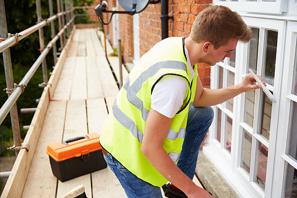 istock Decorator On Scaffolding Painting Exterior House Windows 483421734