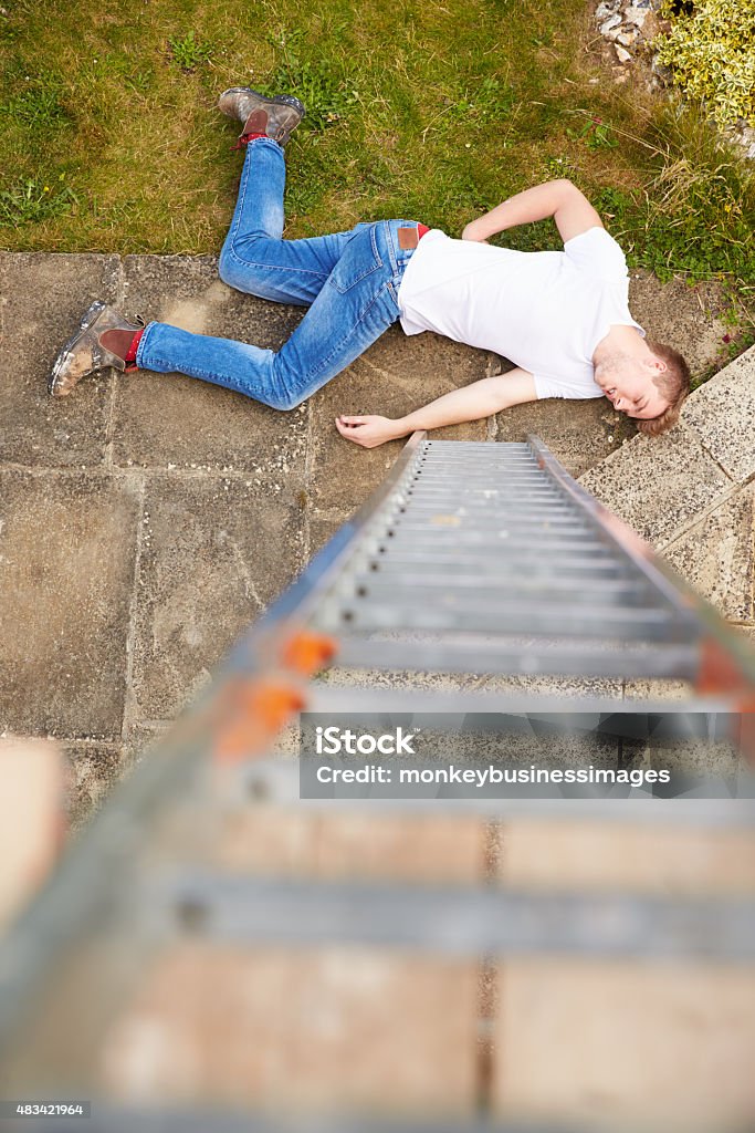 Fall From Ladder Injuries Construction Worker Suffering Injury After Fall From Ladder Stock Photo ...