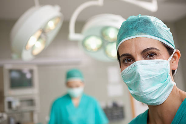 istock Surgeon standing in front of a colleague 483422031