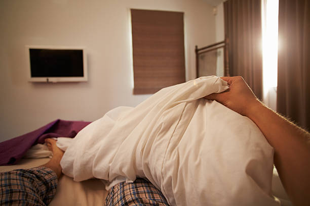Person Getting Out Of Bed In Morning