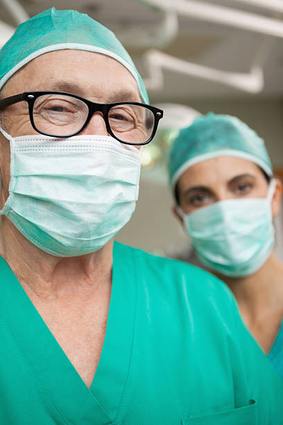 istock Man surgeon with glasses and a colleague 483422495