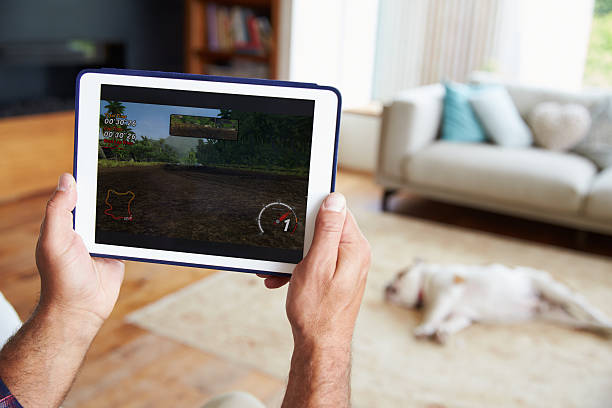istock Close Up Of Man Playing Game On Tablet At Home 483422844