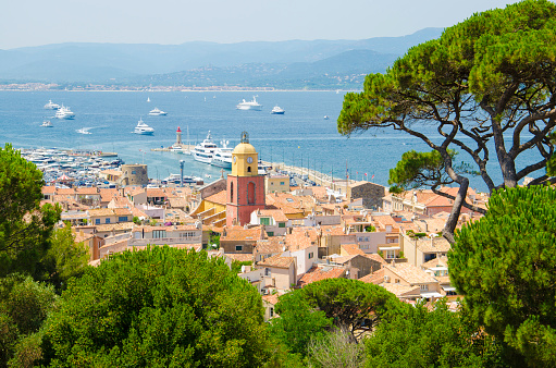 Colour image of the view looking at the city of Saint Tropez in France in summer. The town of St Tropez is a popular French summer holiday resort at the Cote d'Azur and French riviera.