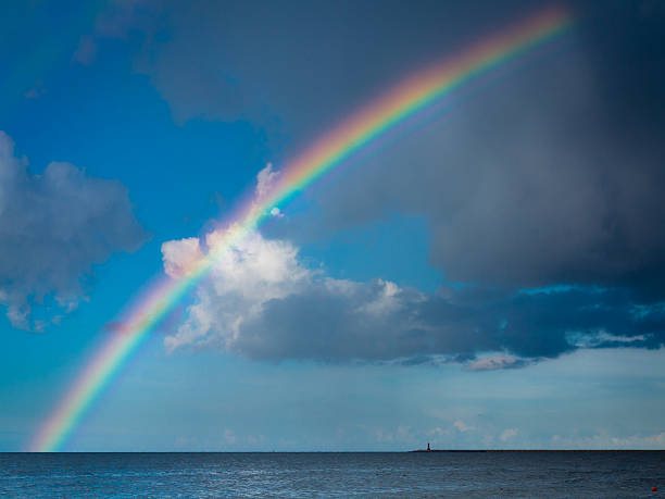 istock landscape view on sky with rainbow at sea. 483423074