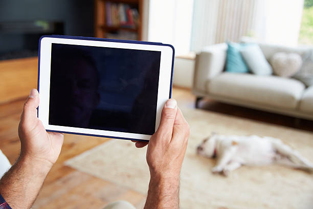 istock Close Up Of Man Using Digital Tablet At Home 483423076