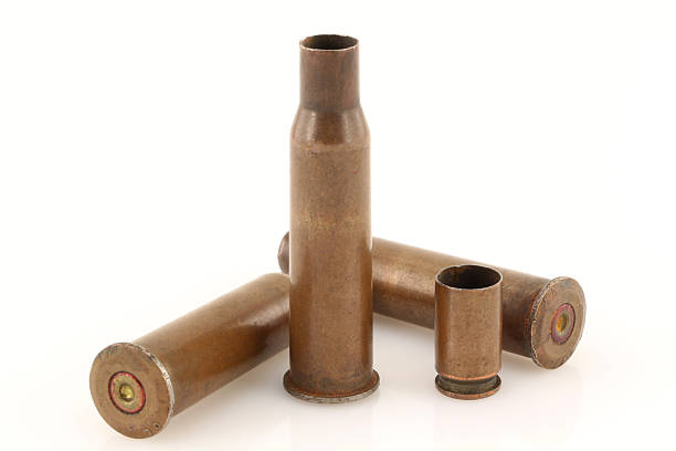 istock Old rusty bullet casings on a white background 483423166