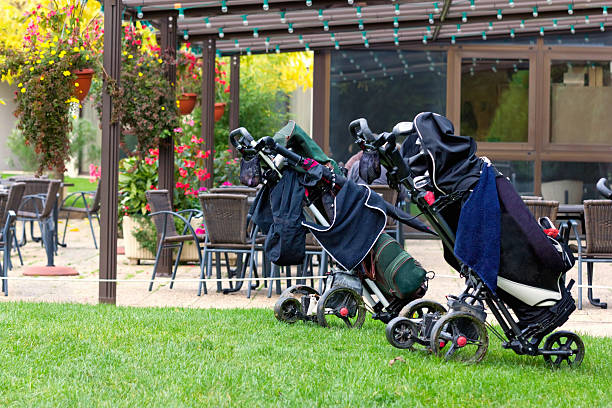 Trolleys of golf clubs