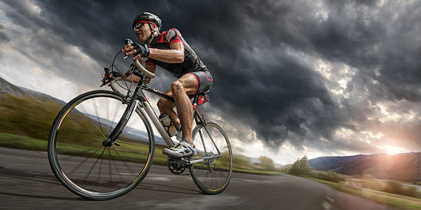 istock Cyclist Riding Hard To Outrun Storm 483423387